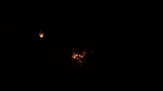 GoPro. Campfire underneath a tarp. Wildcamping