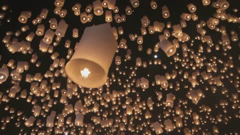 Beautiful fire balloons in night sky.