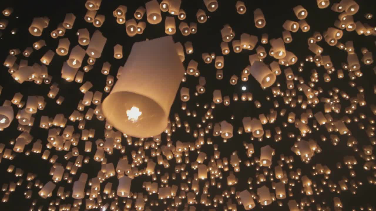 Beautiful fire balloons in night sky.