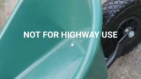 Wheelbarrow With a Funny Warning