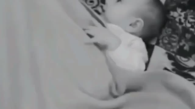 A little girl makes fun of her father because of the way he sleeps