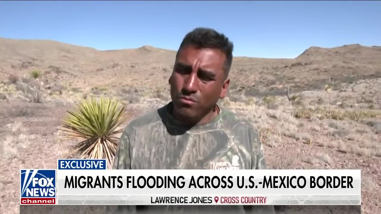 Lawrence Jones speaks with migrants at southern border
