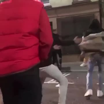 Man gets saved by flying kick in street fight