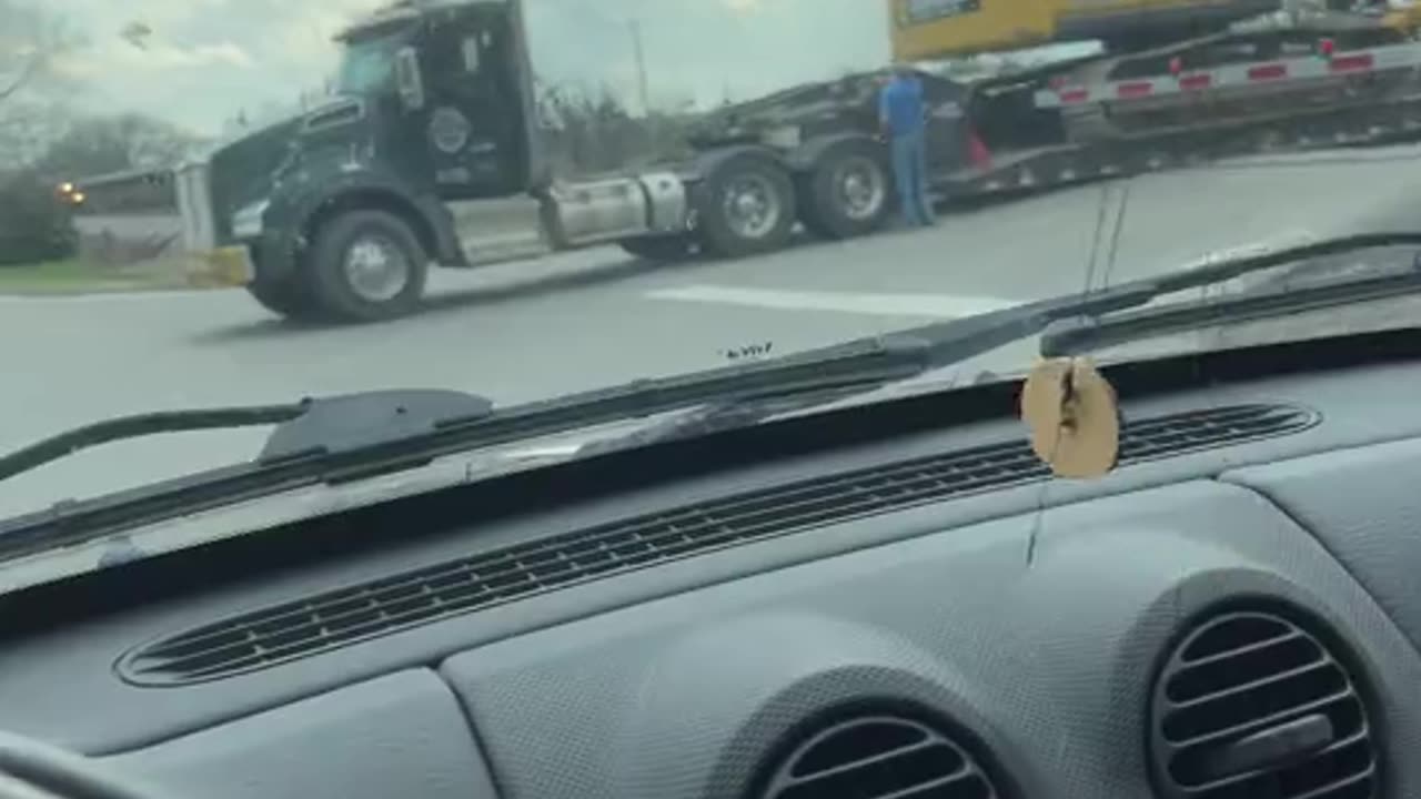 Moving Train Hits a Semi Truck That Is Parked on the Tracks