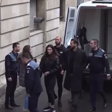 Tate brothers arrive in Bucharest court for hearing.