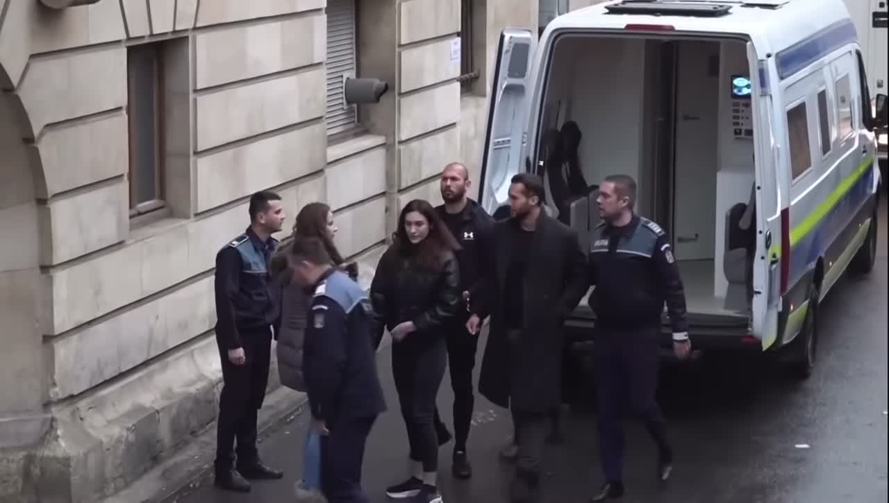 Tate brothers arrive in Bucharest court for hearing.