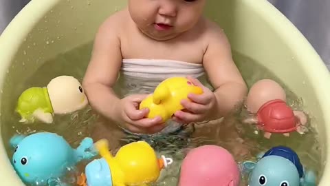 The baby cries every time he takes a bath. My husband arranged a few "little friends"