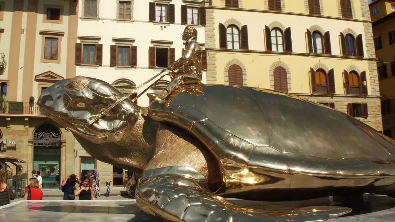 The sculpture of a Golden Turtle of Jan Fabre named Serching for Utopia