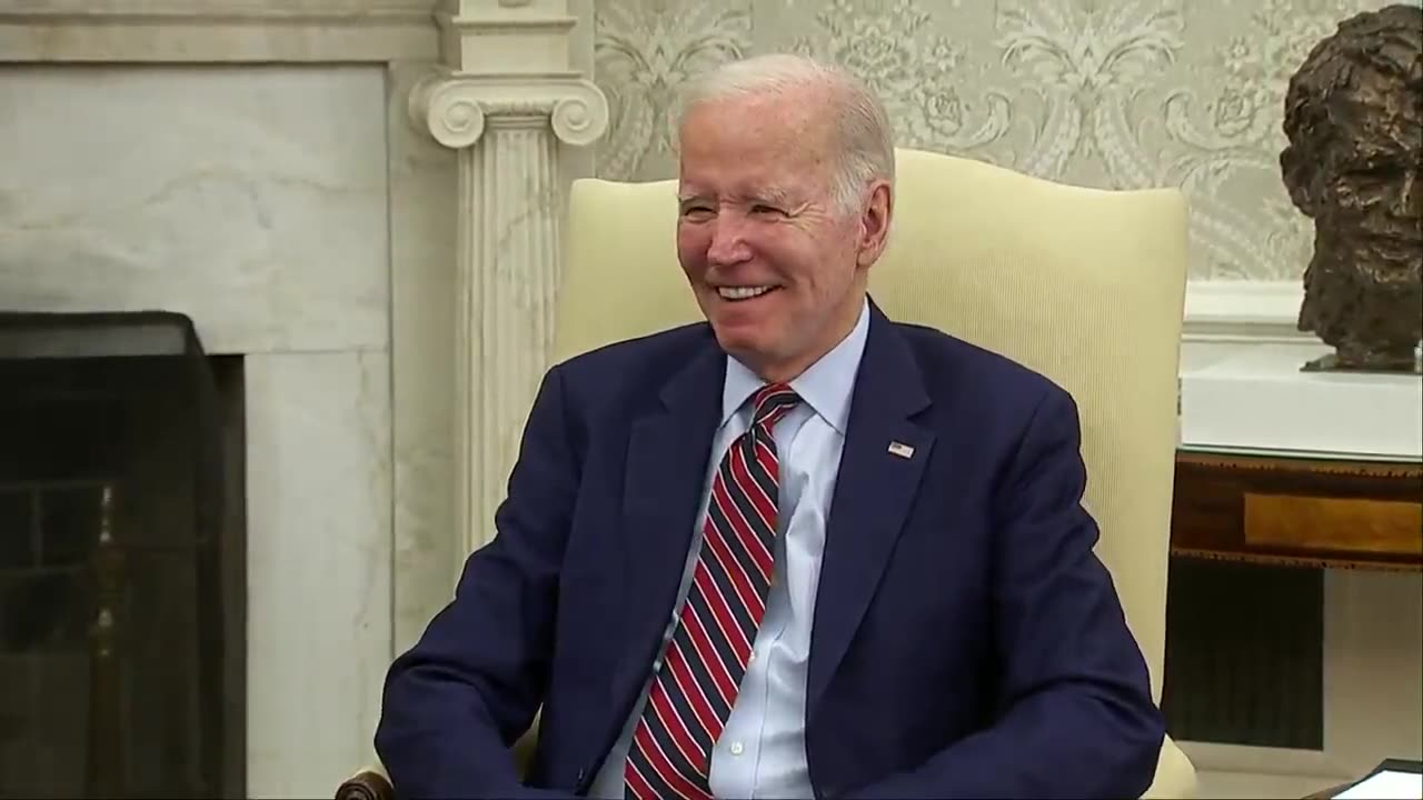 Declining to entertain any questions from the press, Biden remains seated and gazes ahead while