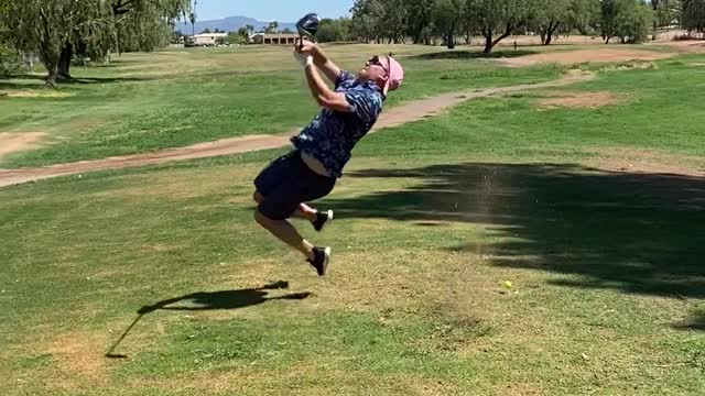 Golf Swing Sends Guy onto the Grass