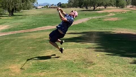 Golf Swing Sends Guy onto the Grass