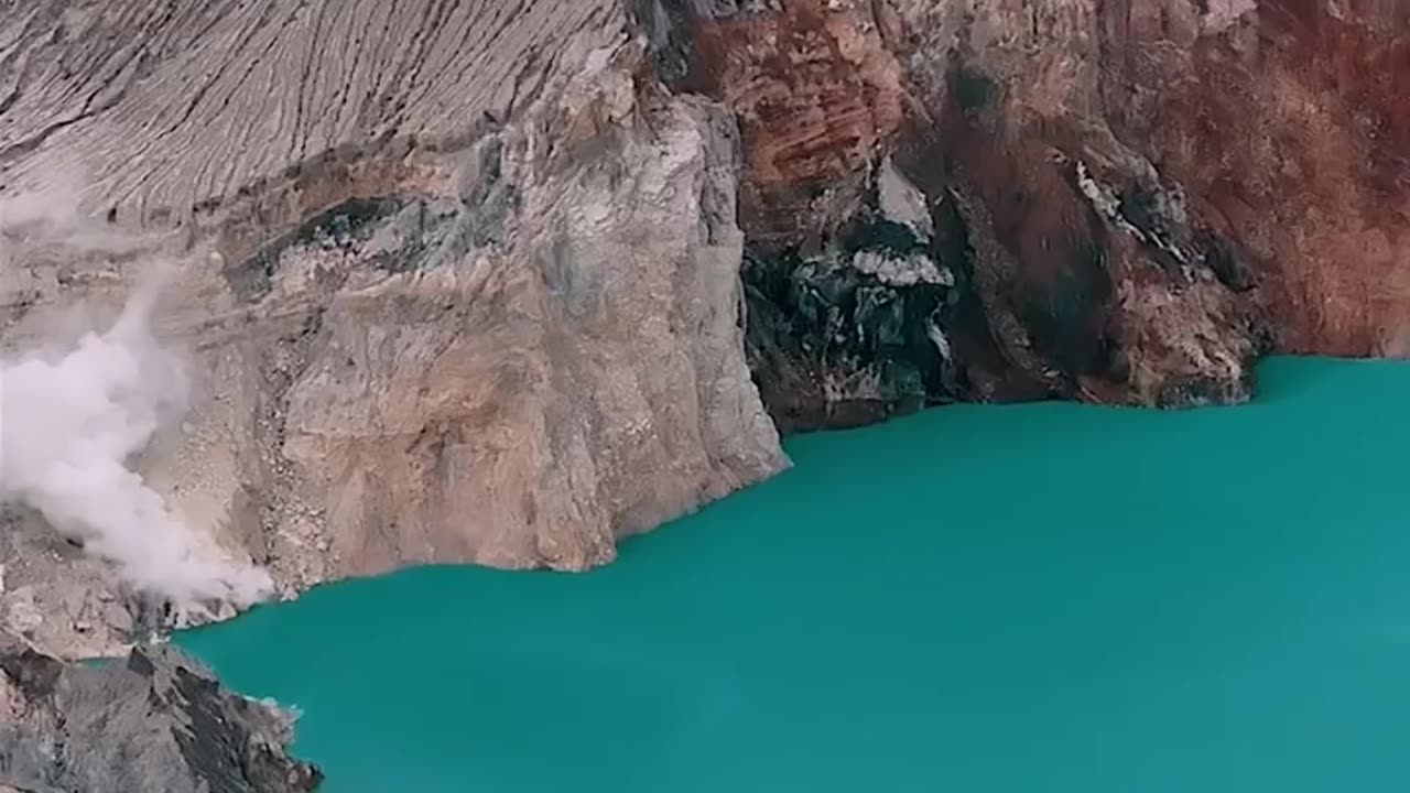 THE LAKE IS RECOGNIZED AS THE LARGEST HIGHLY ACIDIC CRATER LAKE IN THE WORLD KNOWN FOR IT’S BLUE/PURPLE FIRE