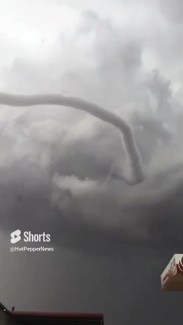 Impressive close-up of a tornado forming in the sky
