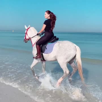 Girl Horse Riding on Beach