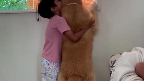 Little boy hugs his doggy best friend