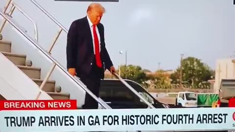 TRUMP GIVES BIG THUMBS UP AS HE WALKS DOWN THE STAIRS IN ATLANTA GEORGIA, NOW ON HIS WAY TO FULTON..