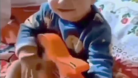 The child is playing the guitar in a cool mood