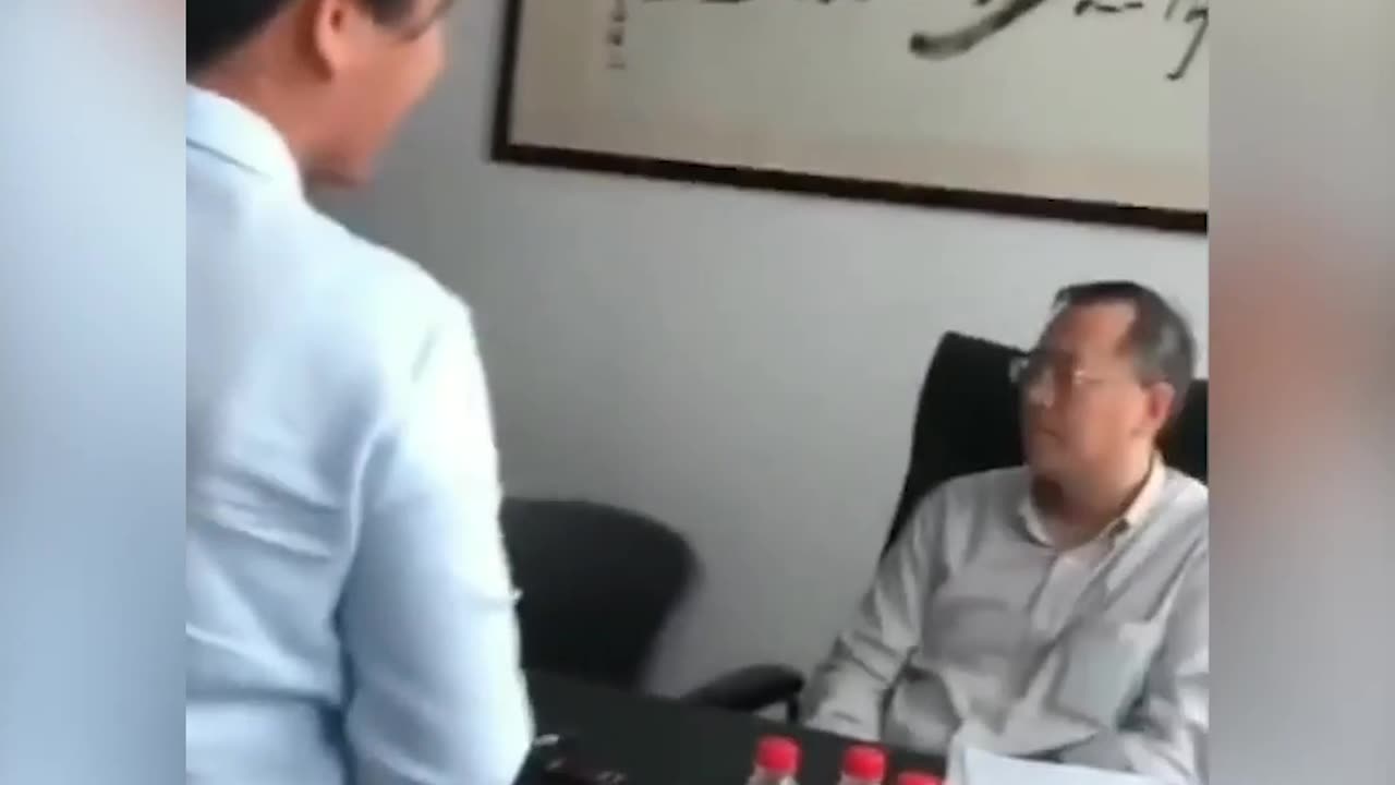 A Chinese woman worker begs her boss for her income
