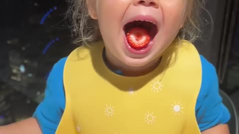 Funny Kids eating! Children are eating tasty strawberry