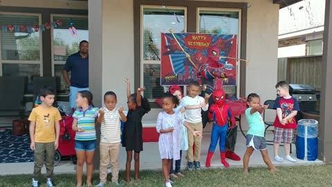 Houston superhero party character spider iron poses with new heroes in Pearland Texas