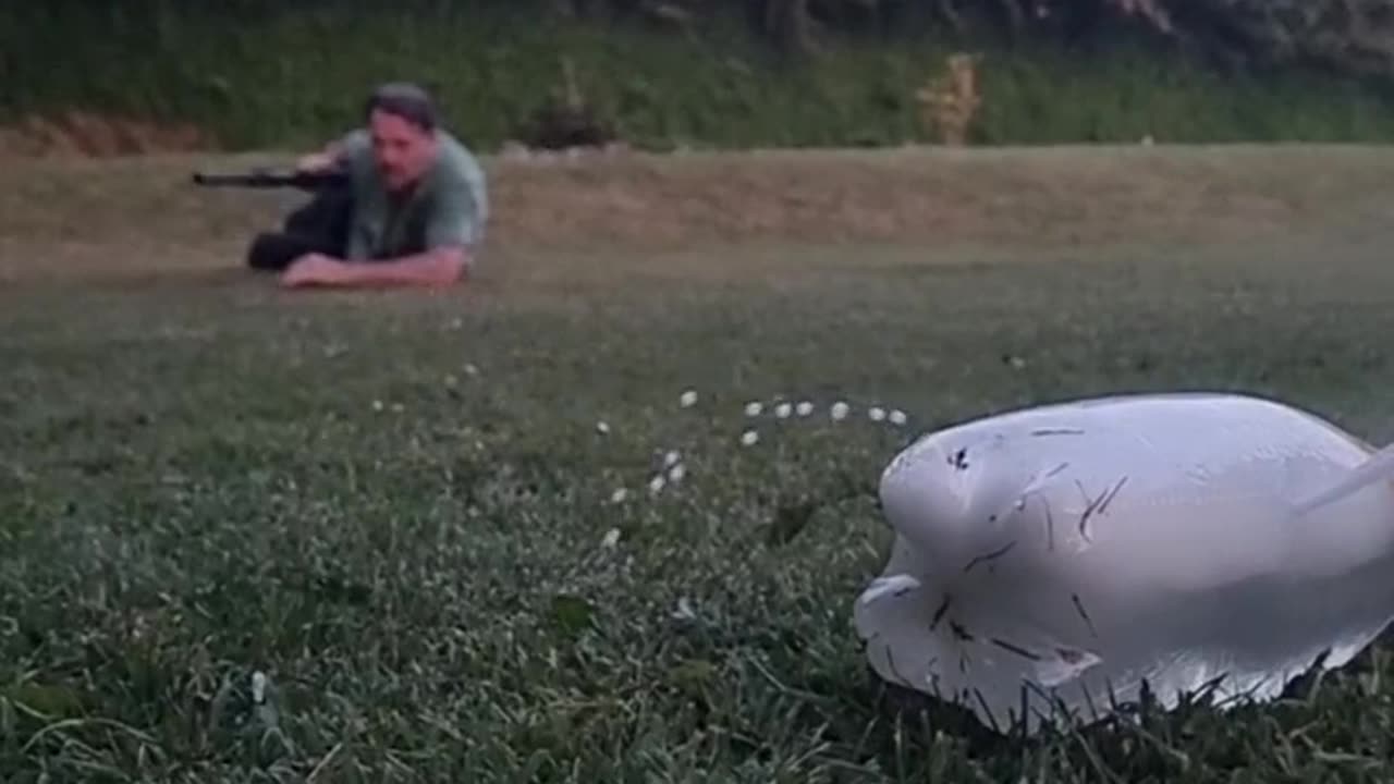 Shooting a Soda Bottle with Air Rifle in Slow Motion