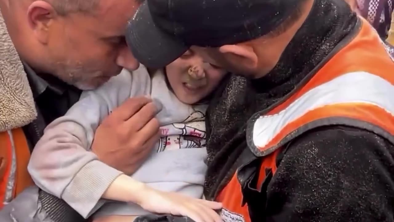 A Palestinian girl’s life is saved by rescue crews in Deir al-Balah