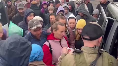 Between the battles for Ukraine, border soldiers help volunteers deliver rubber aid to liberated se