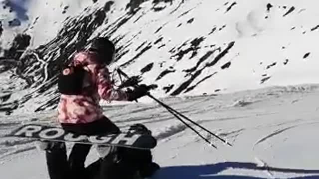 Snowboarder and Skier Work Together to Make Human Sled