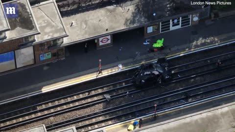 Range Rover ends up on tube track after crashing into parked Tesla