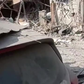 The aftermath of a rocket impact in Rehovot near Tel Aviv