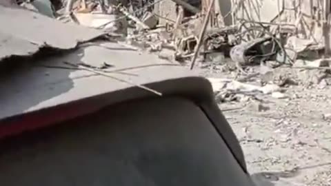 The aftermath of a rocket impact in Rehovot near Tel Aviv