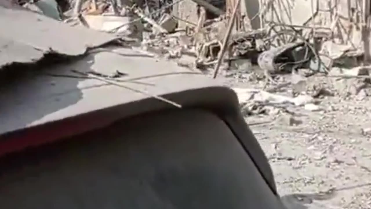 The aftermath of a rocket impact in Rehovot near Tel Aviv