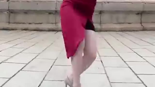 Chinese Woman in Red Dress Dodging Bat