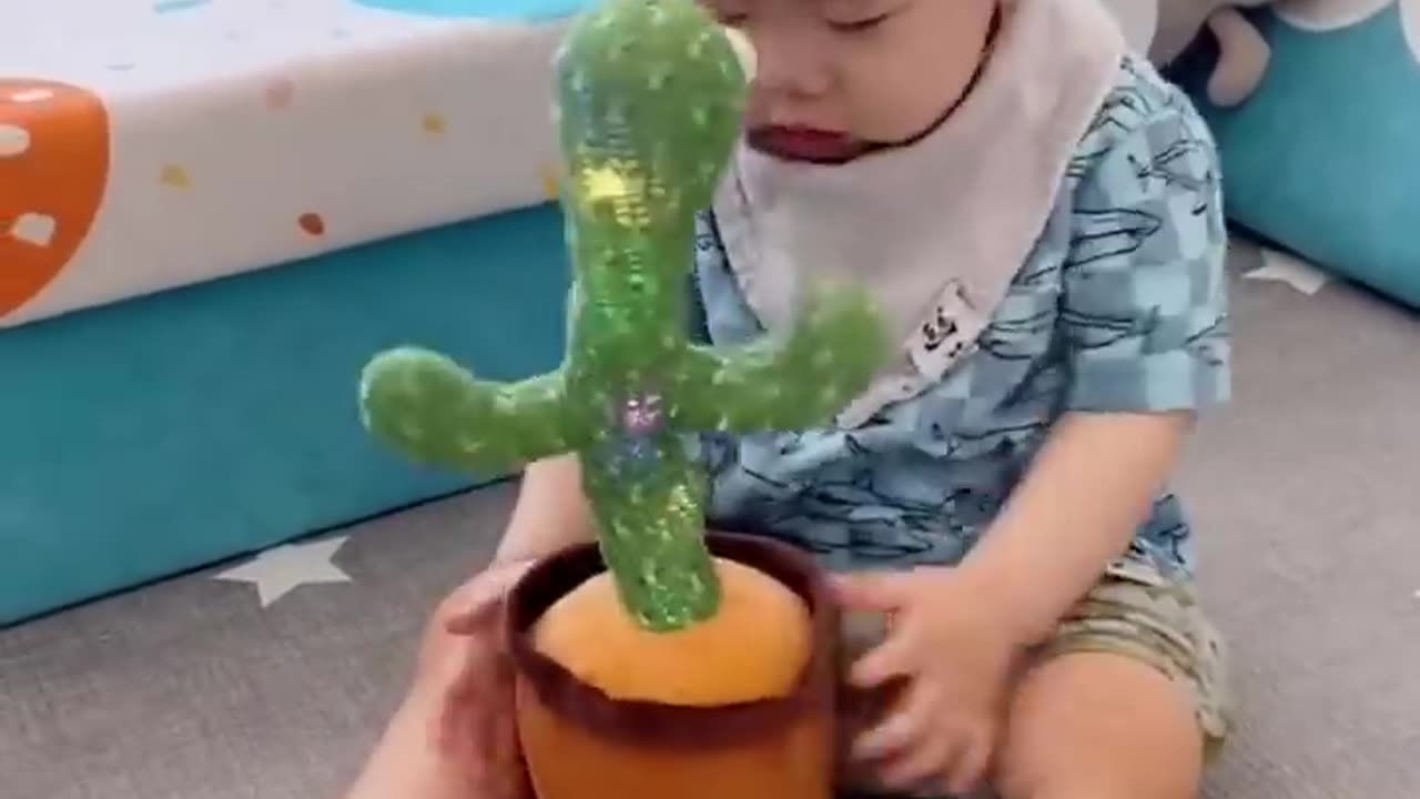 Babies play dancing cactus toy video