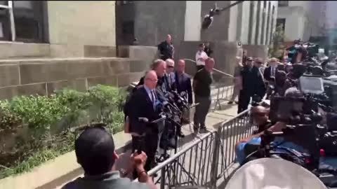 Steve Bannon speaks outside of the courthouse.