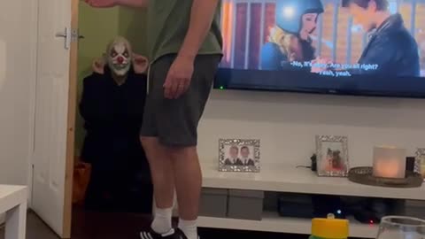Cartoon Reaction to Clown Hiding in Cupboard