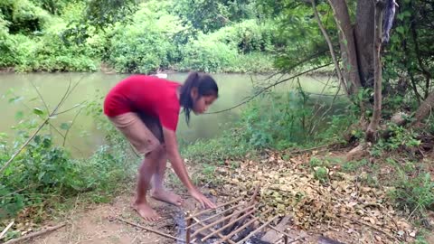 Survival skills_ Catch fish by hand in river & grilled for food - Cooking fish eating delicious