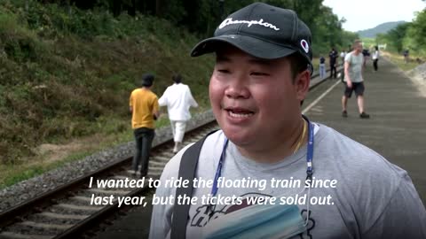 Thailand's 'floating train' a hit as dam waters rise