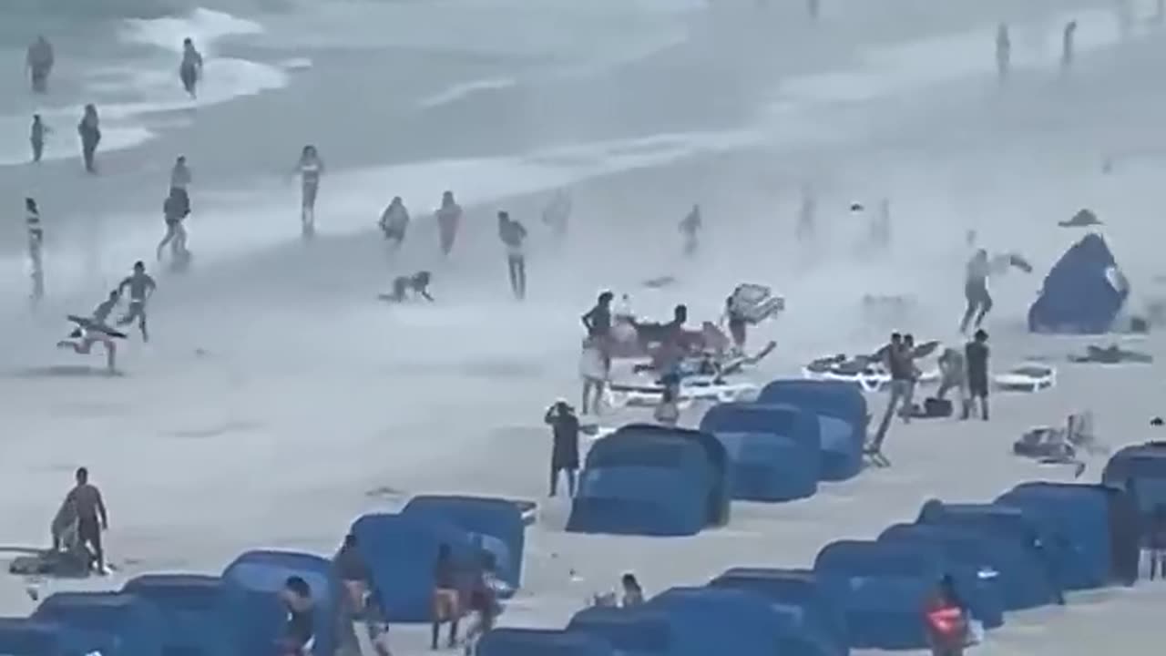 Must Watch ! Footage Captures Waterspout Ripping Through Crowded Beach.