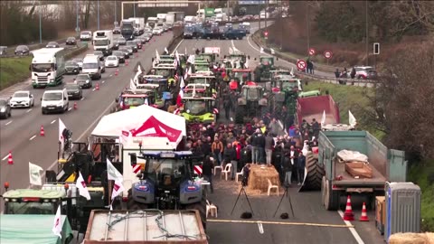 Armored police block French farmers on highway to Paris