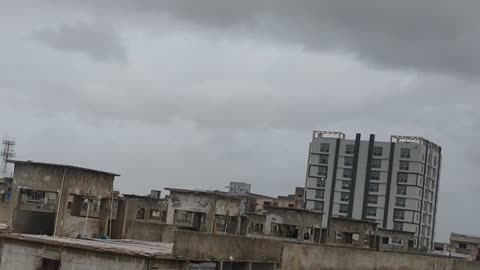 Clouds close to kiss the buildings of karachi.