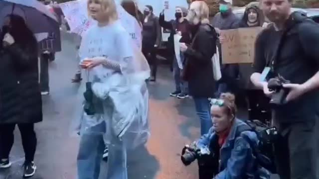 Is this a demon in the middle of this pro abortion protest