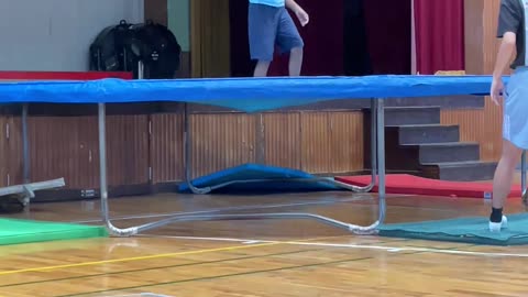 Trampoline sports club enjoying with instructor