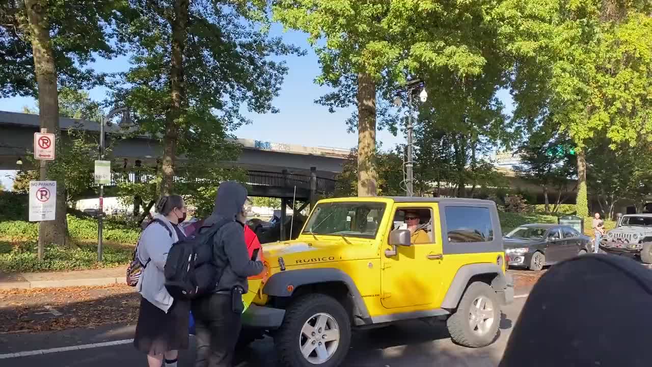 Members of Antifa block innocent man in Jeep