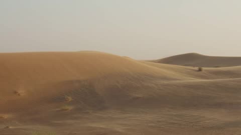 Wind Blowing Over Sand Dunes