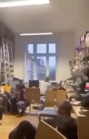 video- Gunshots are audible in the corridor as students take refuge in classrooms.