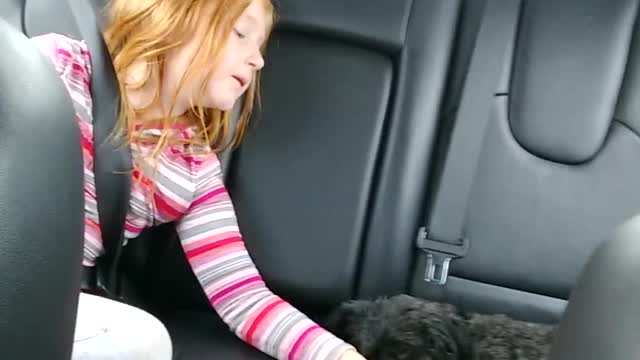 Sweet Girl Sings Her Puppy To Sleep