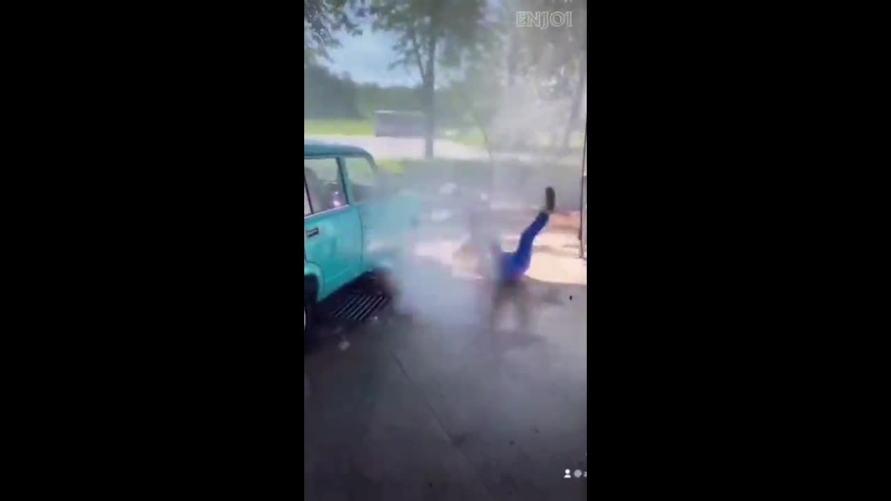 chick gets thrown around by a pressure washer hose