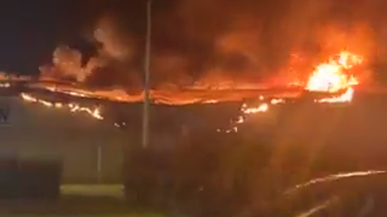 A large shopping center in the suburbs of Paris is completely destroyed by fire.