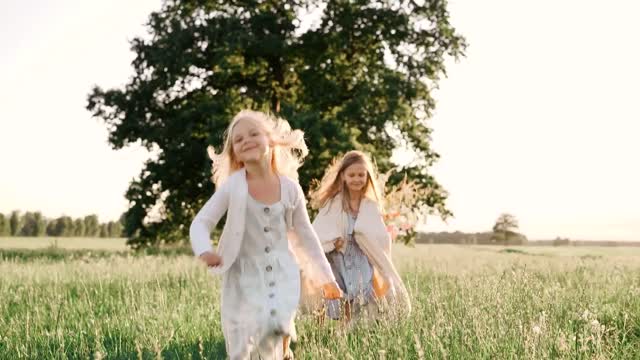 Girls Running on Grass